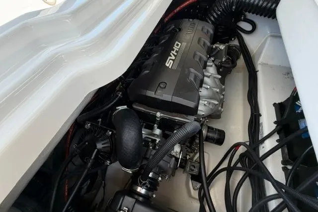 Slide: The Image of Engine compartment of 2021 Yamaha Boats 275SD, showcasing powerful SYHO engine components. - 35