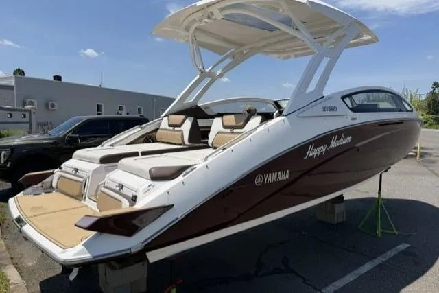 Slide: The Image of 2021 Yamaha Boats 275SD in a parking lot, showcasing sleek design and luxury features. - 7
