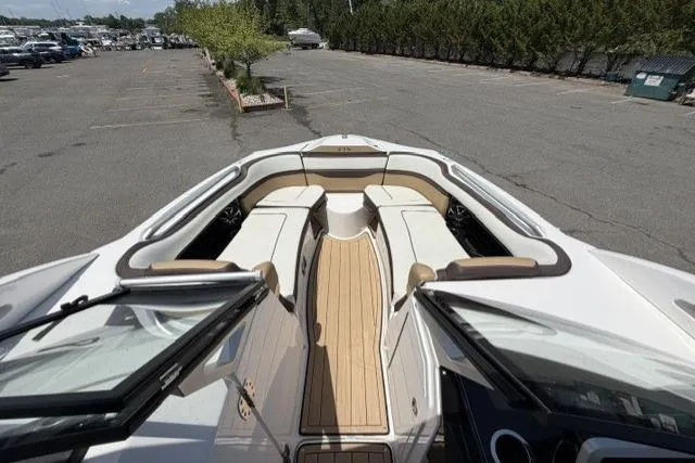 Slide: The Image of 2021 Yamaha Boats 275SD interior with spacious seating and sleek design. - 9