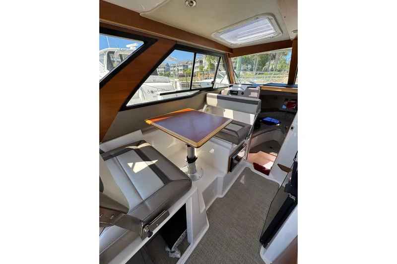 Slide: The Image of Interior of 2022 Cutwater C-248 Coupe boat with seating and table. - 4
