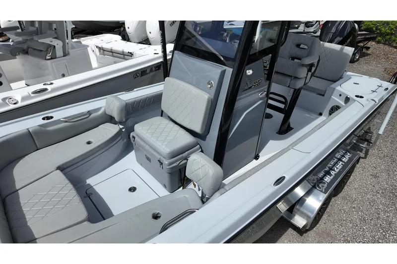 Slide: The Image of 2026 Blazer Bay 2440 boat interior with gray seating and modern design. - 10