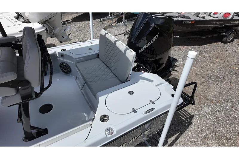 Slide: The Image of 2026 Blazer Bay 2440 boat with Mercury engine, featuring seating and storage compartments. - 12