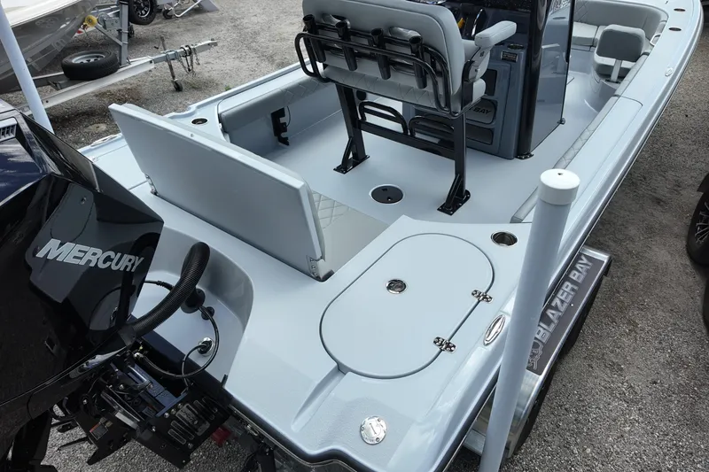 Slide: The Image of 2026 Blazer Bay 2440 boat with Mercury engine, featuring spacious seating and storage. - 4