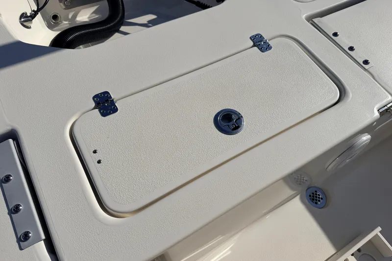 Slide: The Image of 2024 Key West 210 Bay Reef boat deck with storage compartment and latch. - 101