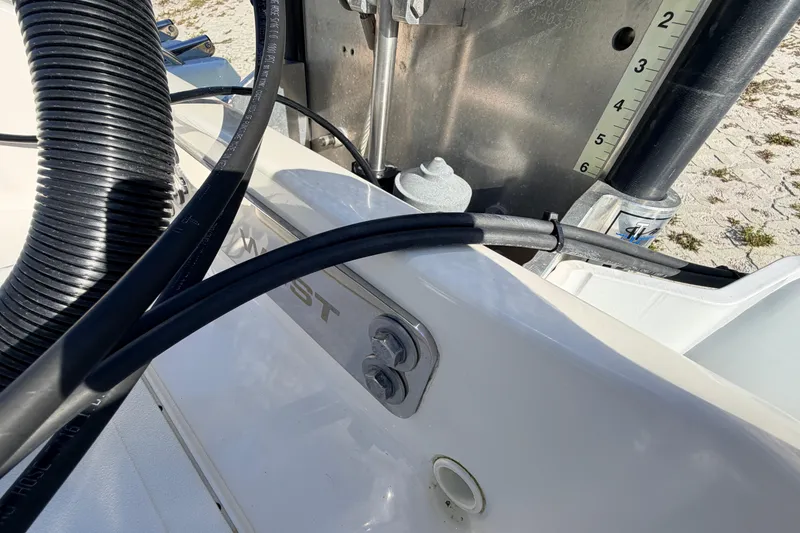 Slide: The Image of 2024 Key West 210 Bay Reef boat detail with cables and measurement markings. - 108