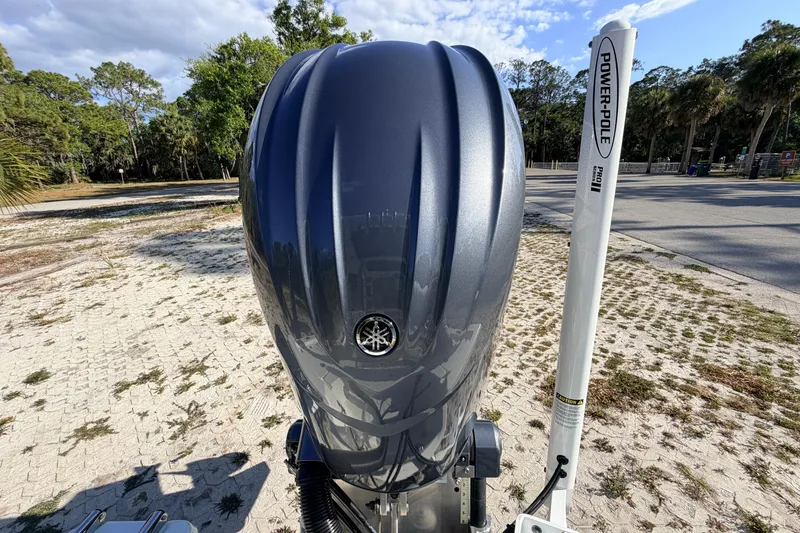 Slide: The Image of 2024 Key West 210 Bay Reef boat engine with Power-Pole in a scenic outdoor setting. - 110