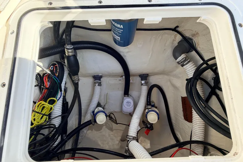 Slide: The Image of 2024 Key West 210 Bay Reef boat wiring and plumbing compartment. - 115