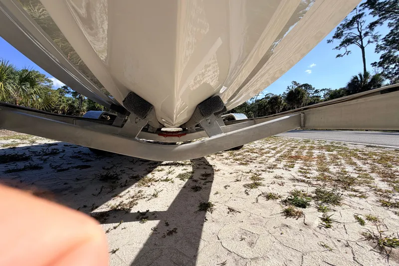 Slide: The Image of Underneath view of a 2024 Key West 210 Bay Reef boat on a trailer. - 12