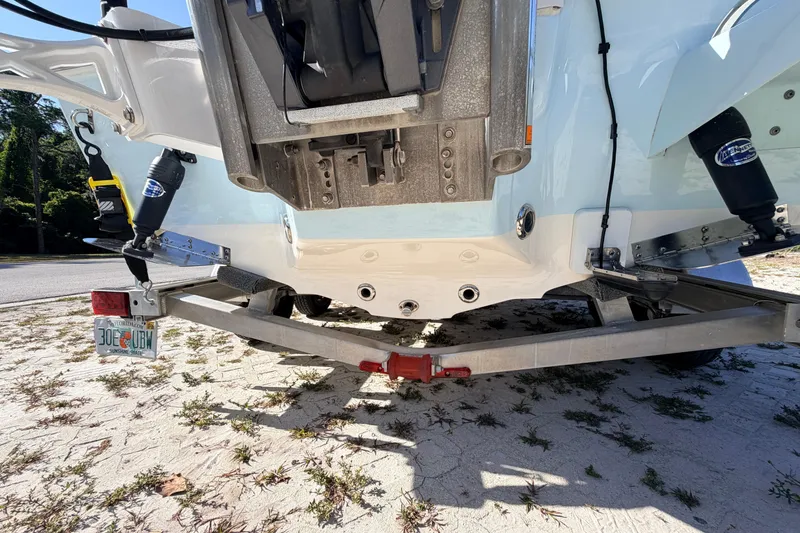 Slide: The Image of Rear view of 2024 Key West 210 Bay Reef boat on trailer, showcasing hull and motor mount. - 17