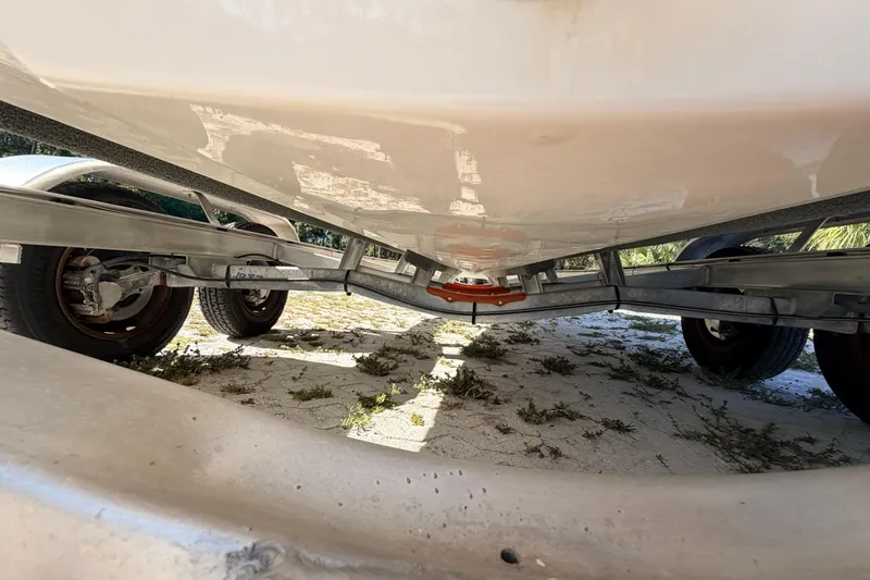 Slide: The Image of Underside view of 2024 Key West 210 Bay Reef boat on trailer. - 18