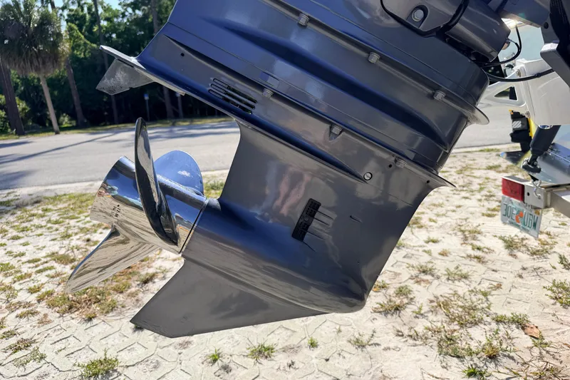 Slide: The Image of 2024 Key West 210 Bay Reef boat motor and propeller close-up. - 24