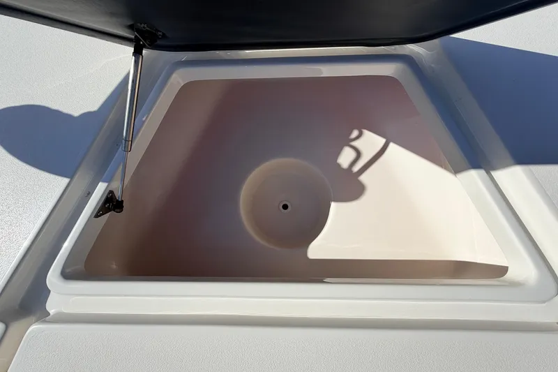 Slide: The Image of Open storage compartment on 2024 Key West 210 Bay Reef boat. - 35