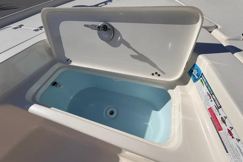 Slide: The Image of Open storage compartment on 2024 Key West 210 Bay Reef boat, showcasing interior design. - 41
