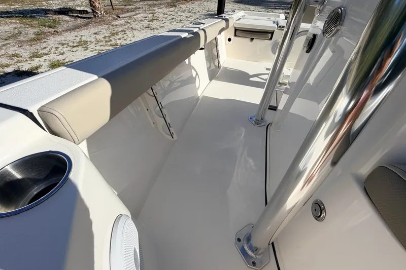Slide: The Image of 2024 Key West 210 Bay Reef boat interior with stainless steel features and cushioned seating. - 52