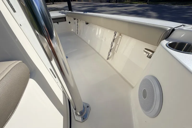 Slide: The Image of 2024 Key West 210 Bay Reef boat interior with speaker and seating detail. - 53
