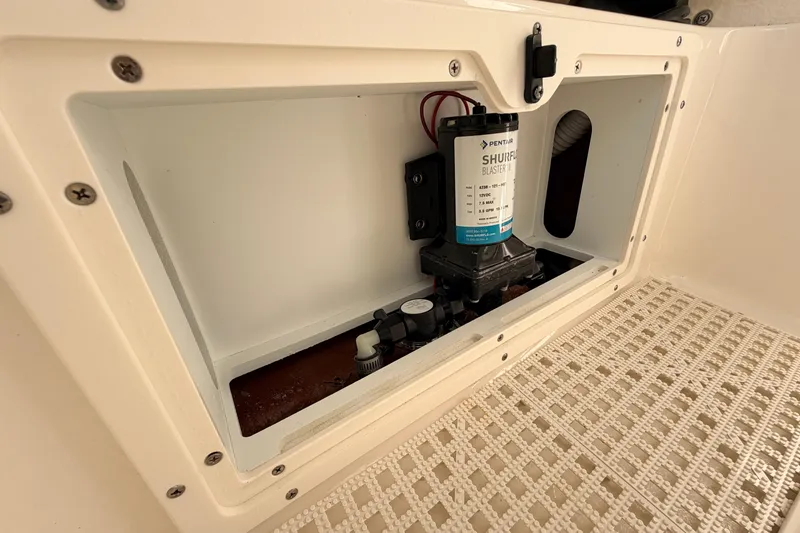 Slide: The Image of 2024 Key West 210 Bay Reef boat compartment with pump system. - 61