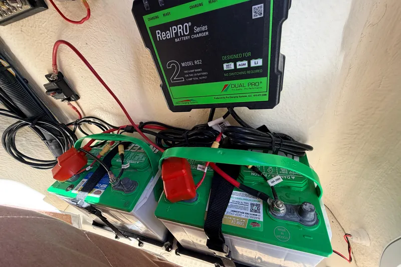 Slide: The Image of Battery setup with RealPRO charger in 2024 Key West 210 Bay Reef boat. - 63