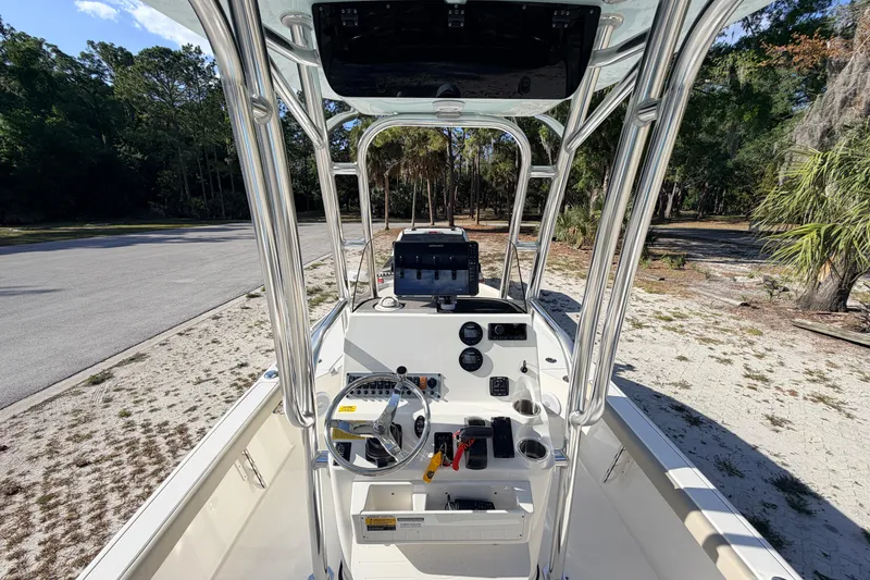 Slide: The Image of 2024 Key West 210 Bay Reef boat interior with steering console and navigation equipment. - 66