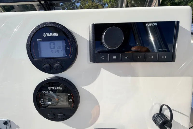 Slide: The Image of Dashboard of 2024 Key West 210 Bay Reef with Yamaha gauges and Fusion audio system. - 69