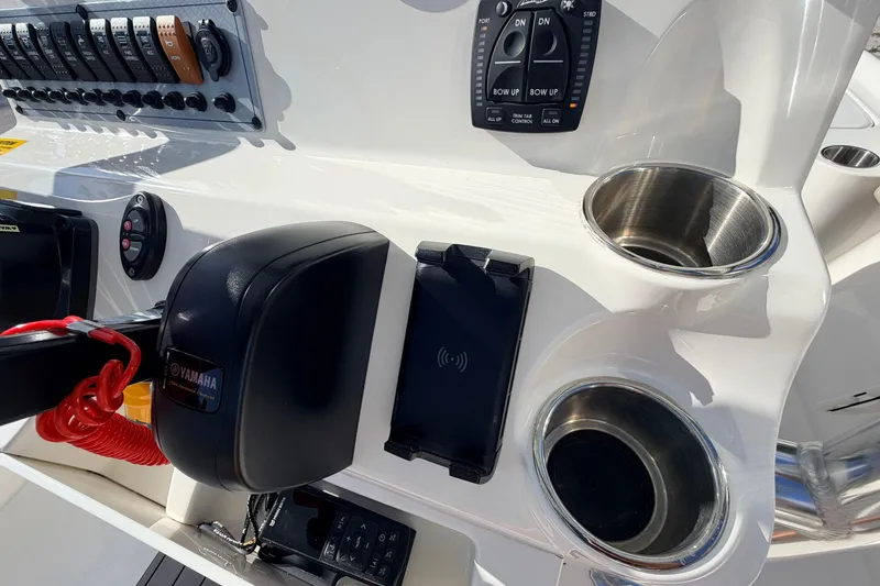 Slide: The Image of 2024 Key West 210 Bay Reef boat console with Yamaha controls and cup holders. - 70