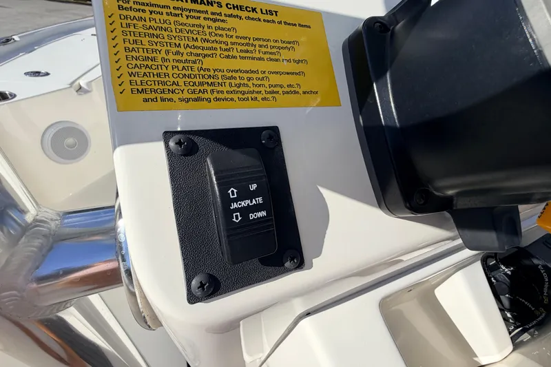 Slide: The Image of Control panel on 2024 Key West 210 Bay Reef boat with checklist and jackplate switch. - 73