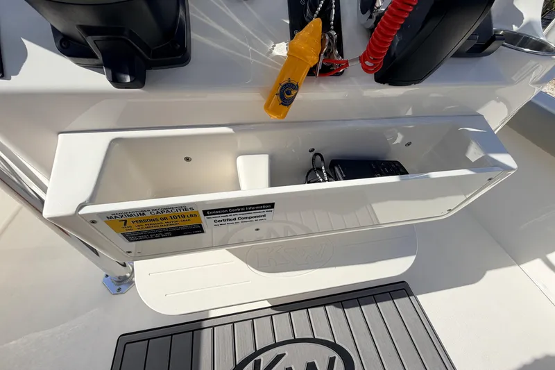 Slide: The Image of 2024 Key West 210 Bay Reef boat console with storage compartment and safety equipment. - 75