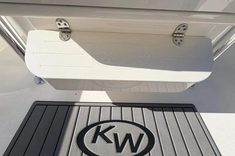 Slide: The Image of 2024 Key West 210 Bay Reef boat with KW logo on step and mat. - 77