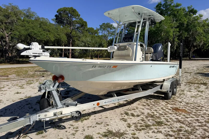 Slide: The Image of 2024 Key West 210 Bay Reef boat on trailer, parked outdoors. - 8