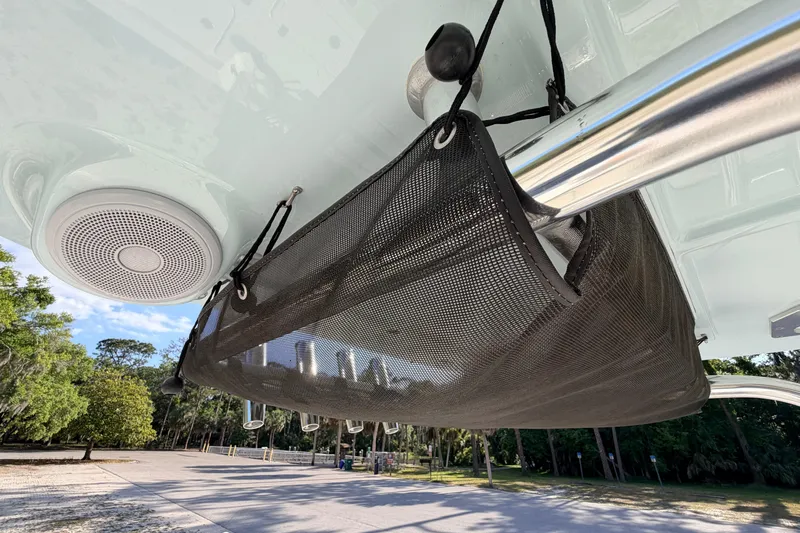 Slide: The Image of 2024 Key West 210 Bay Reef boat with speaker and storage netting. - 82