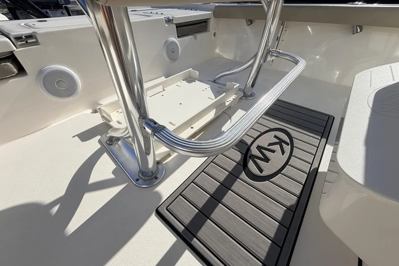 Slide: The Image of 2024 Key West 210 Bay Reef boat interior with stainless steel fittings and KW logo mat. - 85