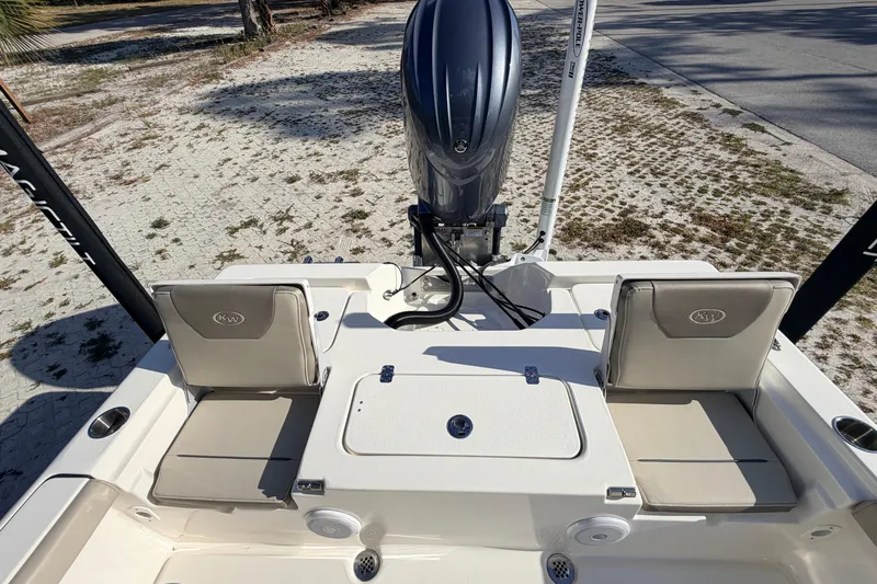 Slide: The Image of 2024 Key West 210 Bay Reef boat with dual seats and outboard motor. - 95