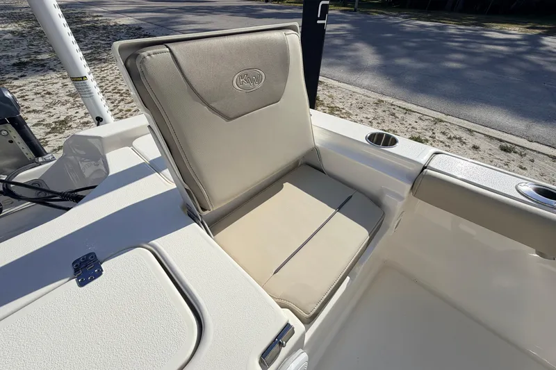 Slide: The Image of 2024 Key West 210 Bay Reef boat seat with cup holders, beige upholstery. - 97