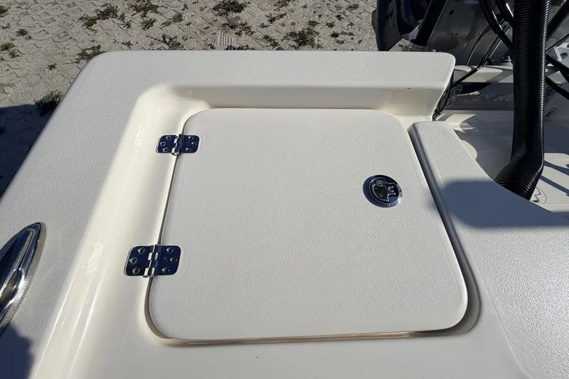 Slide: The Image of 2024 Key West 210 Bay Reef boat hatch with stainless steel hinges and latch. - 98