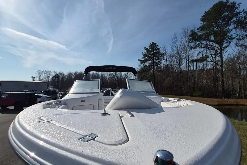 Slide: The Image of 2015 Sea Fox 226 Traveler boat with canopy, parked outdoors under clear sky. - 10