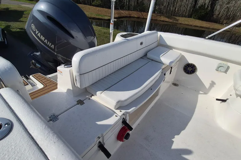 Slide: The Image of 2015 Sea Fox 226 Traveler boat interior with Yamaha engine and white seating. - 11