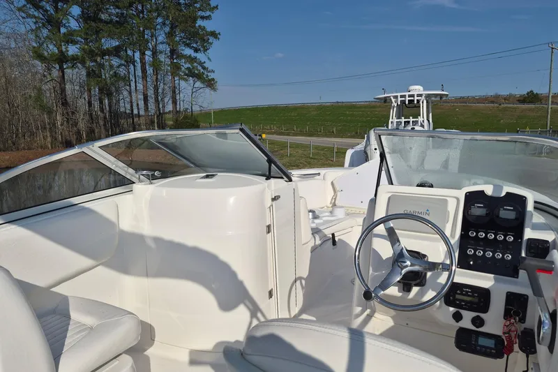 Slide: The Image of 2015 Sea Fox 226 Traveler boat interior with steering wheel and dashboard controls. - 12