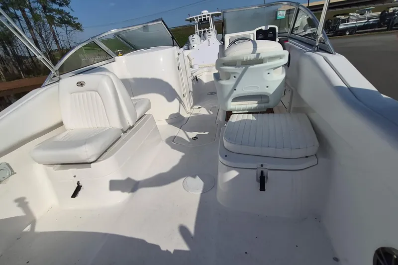 Slide: The Image of 2015 Sea Fox 226 Traveler boat interior with white seating and steering console. - 14