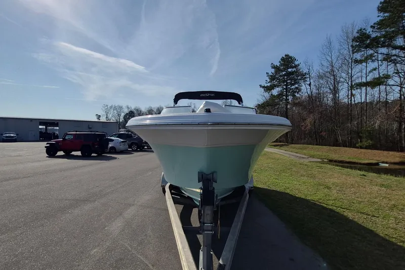 Slide: The Image of 2015 Sea Fox 226 Traveler boat on trailer, parked outdoors under clear sky. - 6