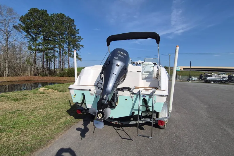 Slide: The Image of 2015 Sea Fox 226 Traveler boat with outboard motor on trailer, parked outdoors. - 7