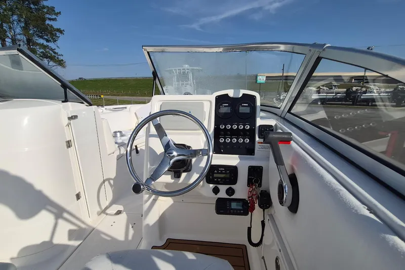 Slide: The Image of 2015 Sea Fox 226 Traveler boat cockpit with steering wheel and control panel. - 9