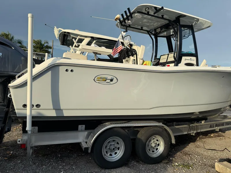 Slide: The Image of 2023 Sea Hunt Gamefish 27 with Coffin Box on trailer, side view. - 18