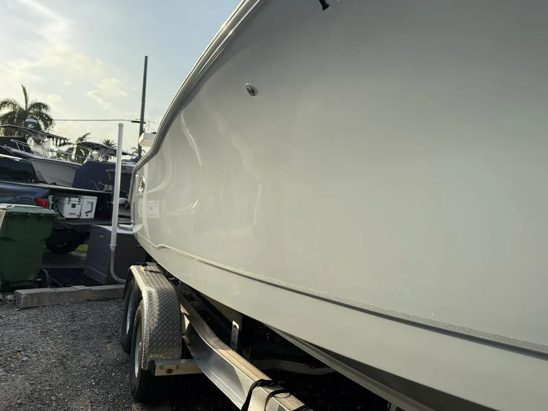 Slide: The Image of 2023 Sea Hunt Gamefish 27 with Coffin Box on trailer, side view. - 20