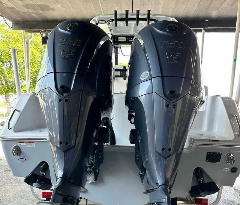 Slide: The Image of 2023 Sea Hunt Gamefish 27 with twin outboard engines, rear view. - 3