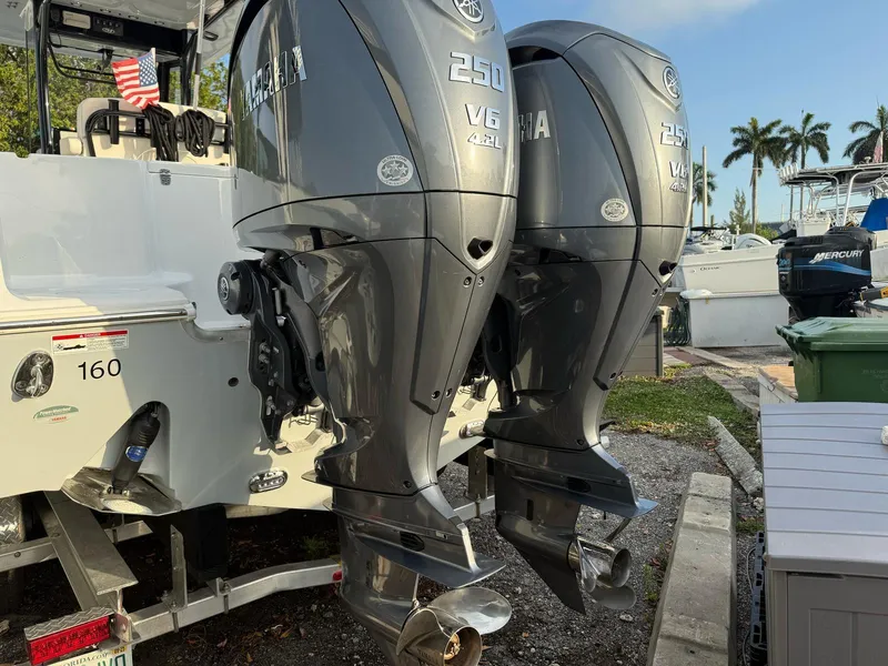 Slide: The Image of Twin Yamaha 250 V6 outboard engines on a 2023 Sea Hunt Gamefish 27 boat. - 5