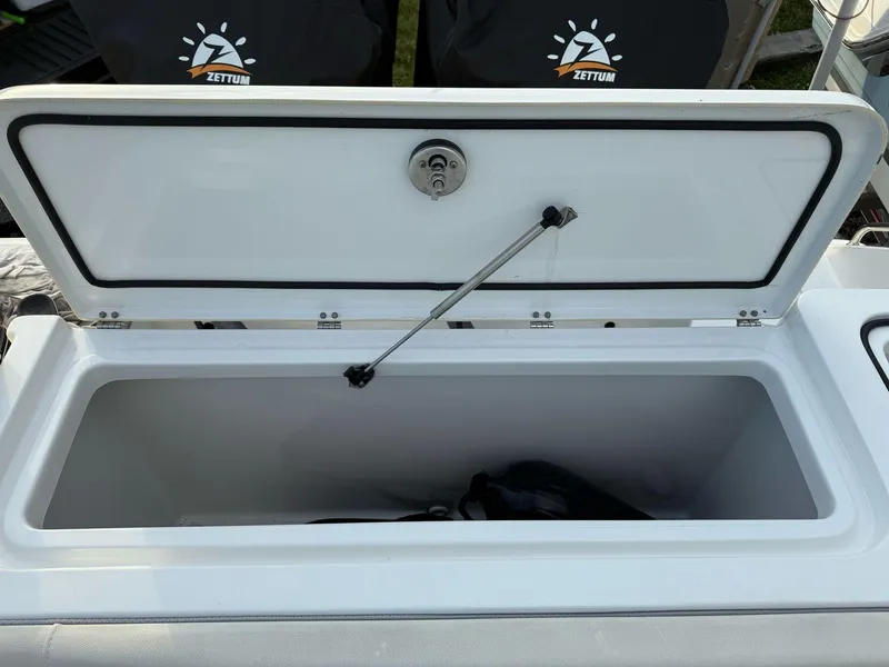 Slide: The Image of 2023 Sea Hunt Gamefish 27 Coffin Box, open lid, spacious storage compartment. - 7