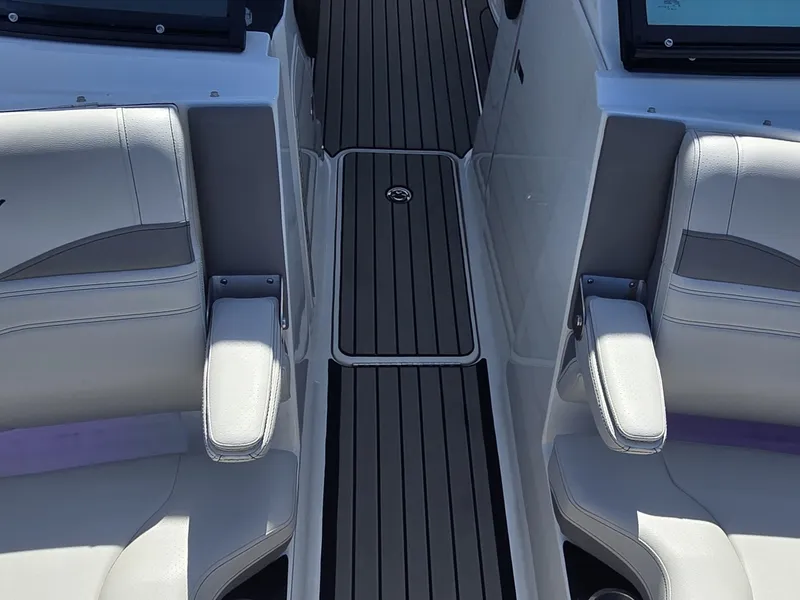 Slide: The Image of The 2026 Sea Ray SLX 260 Surf features luxurious seating and a sleek deck design. - 26
