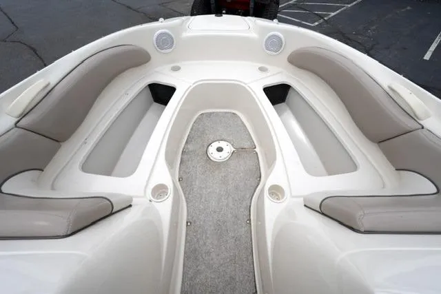 Slide: The Image of Interior view of a 2002 Sea Ray 190 Sundeck boat with cushioned seating. - 10