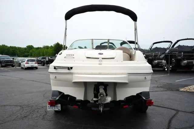 Slide: The Image of 2002 Sea Ray 190 Sundeck boat on trailer, rear view in parking lot. - 6