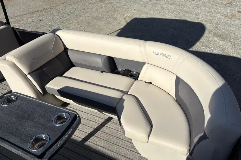 Slide: The Image of 2023 Harris Cruiser 230 boat seating with cup holders and elegant upholstery. - 14