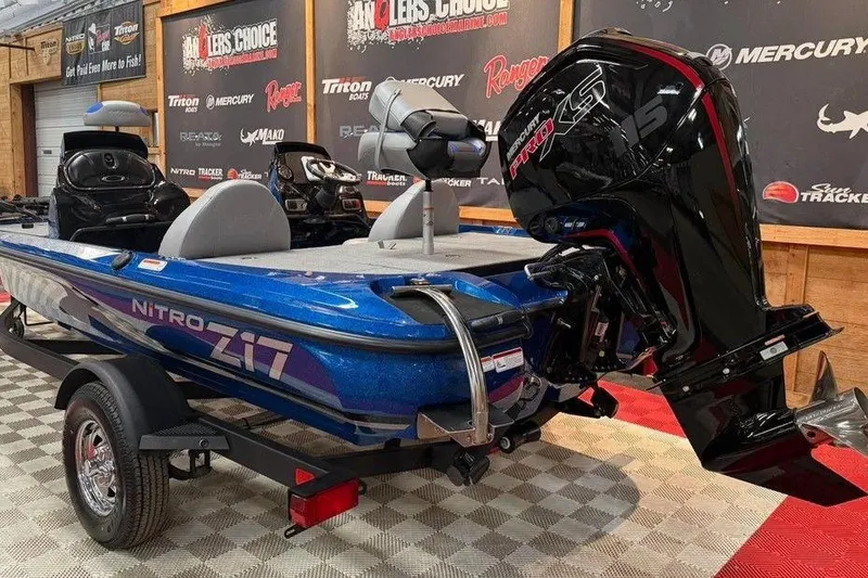 Slide: The Image of 2026 Nitro Z17 boat with Mercury Pro XS engine on display in showroom. - 3
